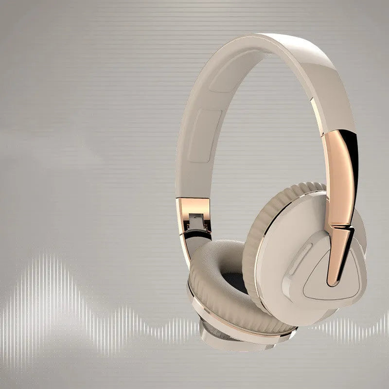 Wireless over-ear headset in black with soft ear cushions, showing AUX audio jack port.