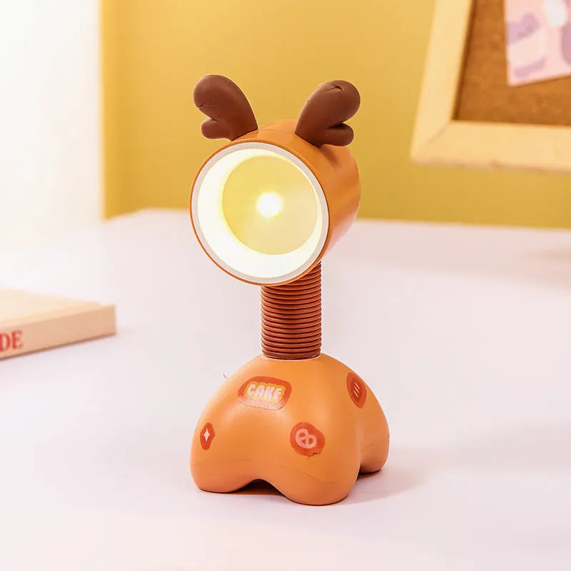 DIY cartoon magnetic small night lamp in assorted animal styles and colours on a desktop.