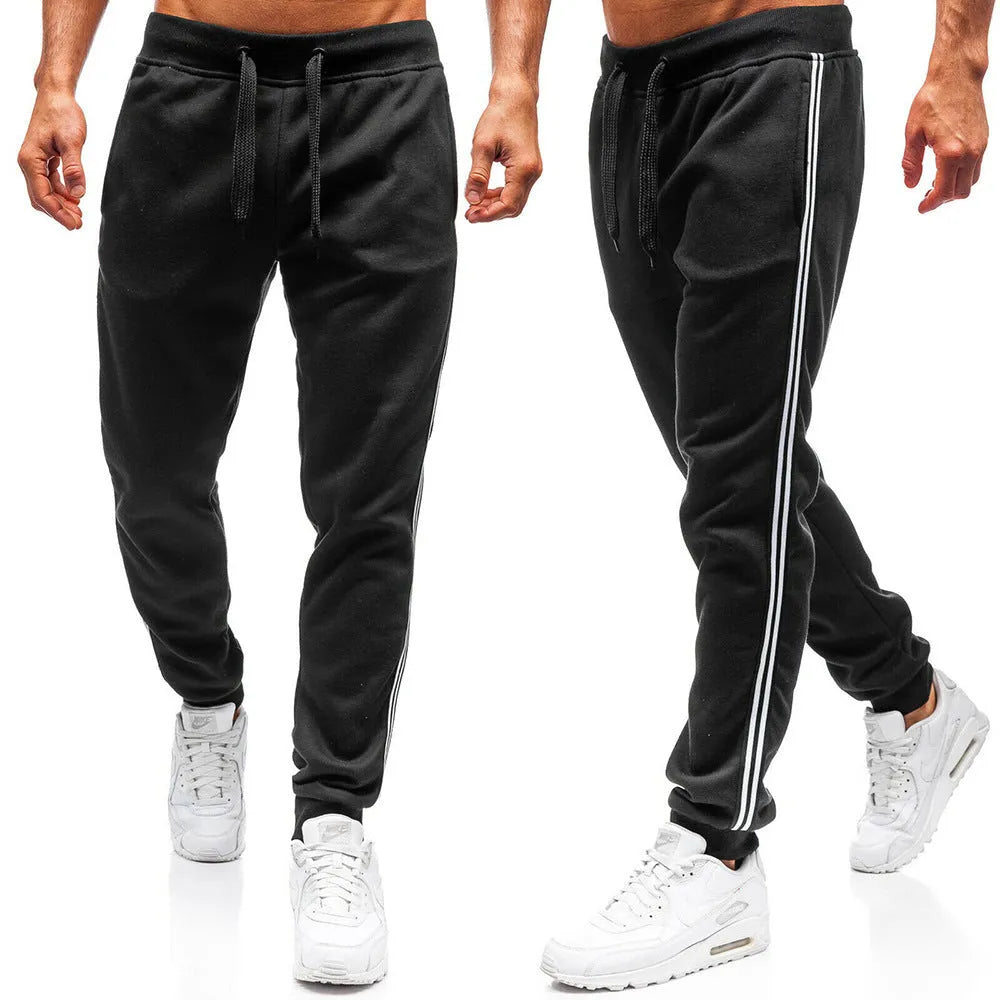 Men's summer casual loose tapered sports trousers in black with elastic waist, drawstring, and stitching details