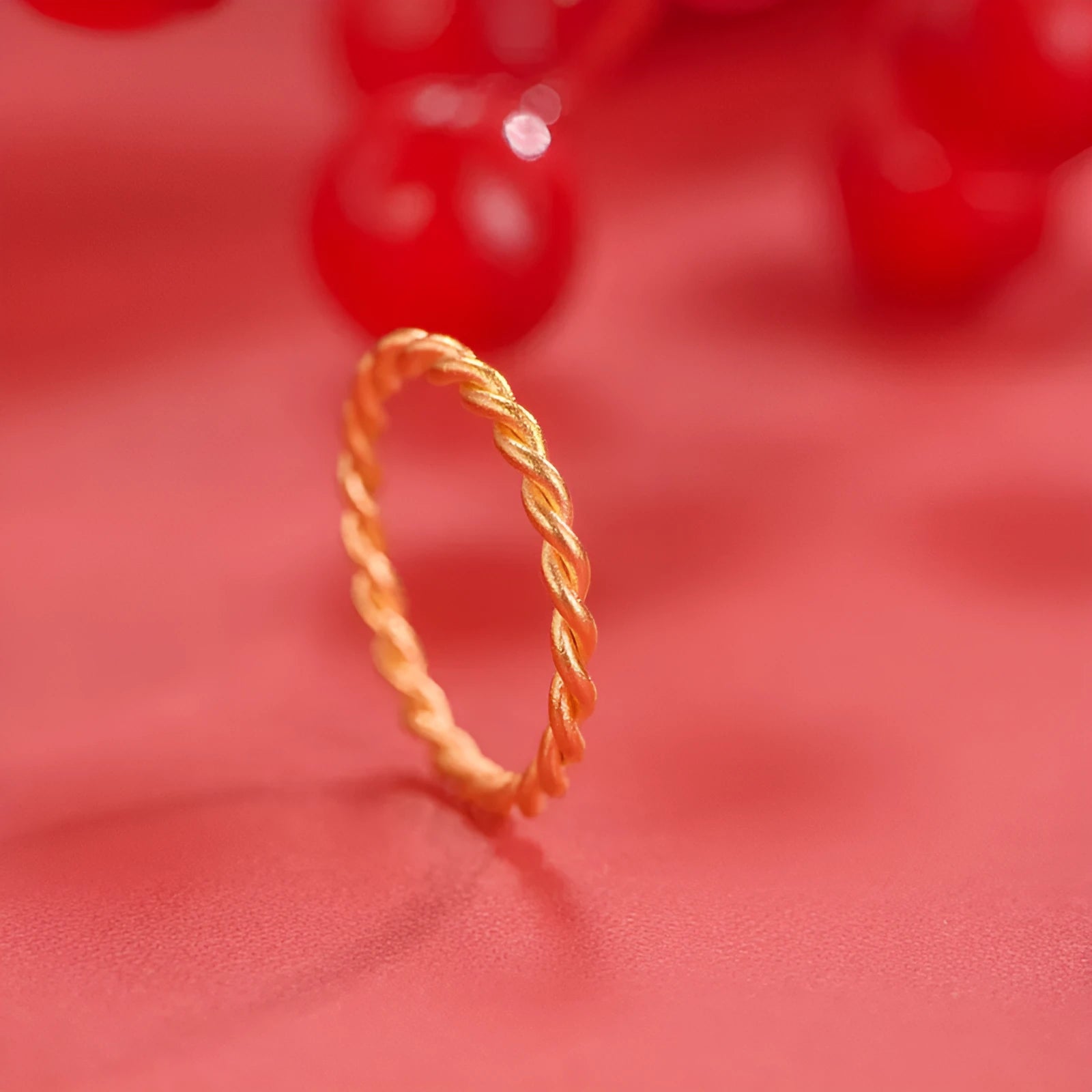 A brass gold plated women's ring in a simple bracelet design, shown in glossy, matte, and twist style variations.