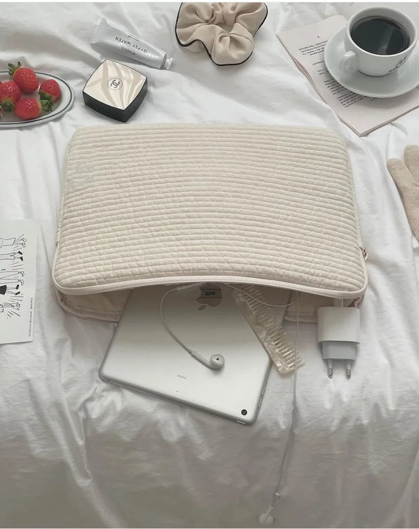 Black and white hand-held cotton cloth laptop clutch bag for tablet protection with coin pocket.