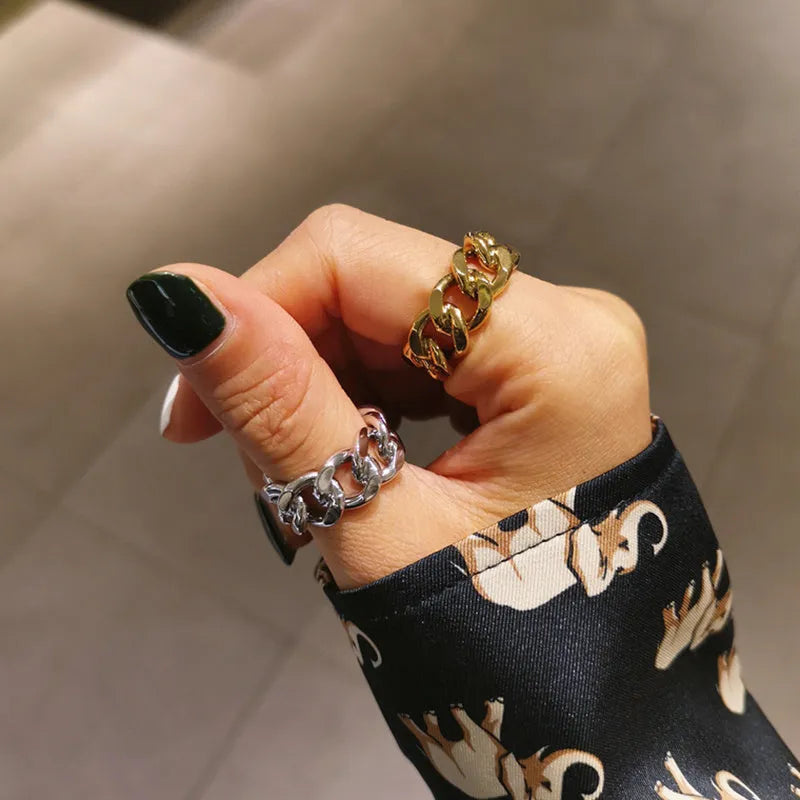 Golden aluminium alloy adjustable geometric ring chain on white background