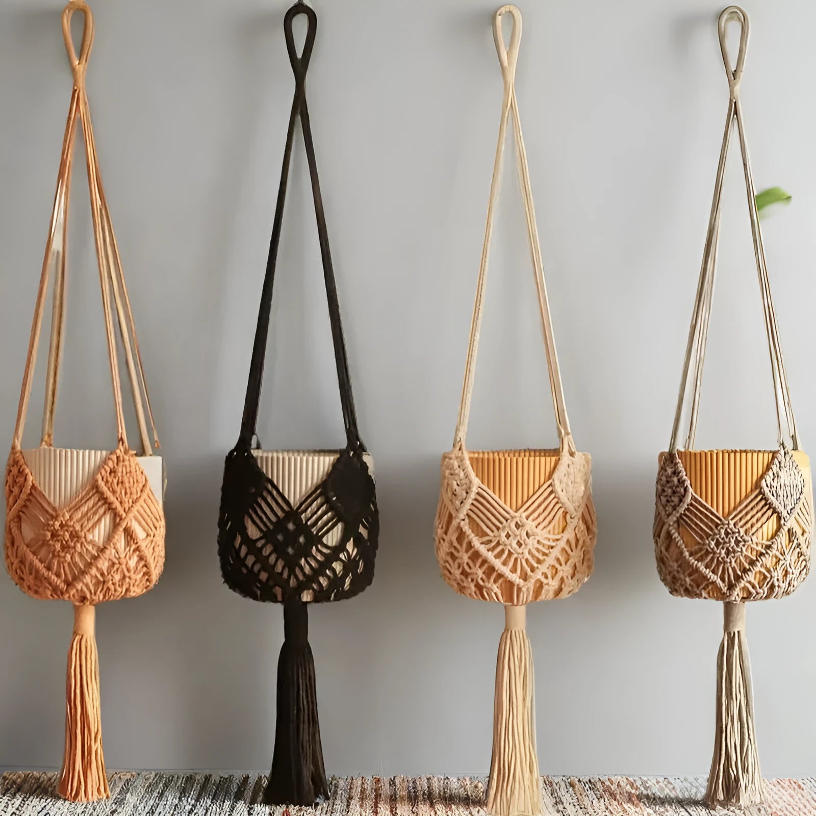 Hand-woven brown polyester cotton flower pot with net pocket cord holding a green plant.