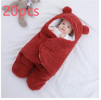 Baby quilted sleeping bag wrapper in a light blue colour showing its quilted pattern and size.