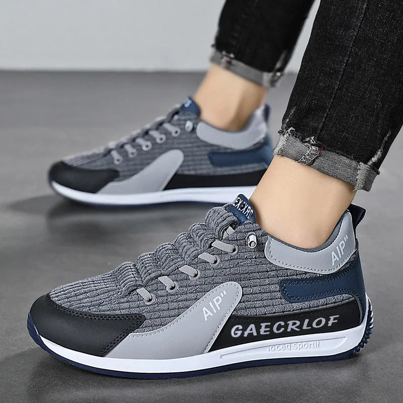 Men's grey and green mesh running shoes with lace-up closure and round toe