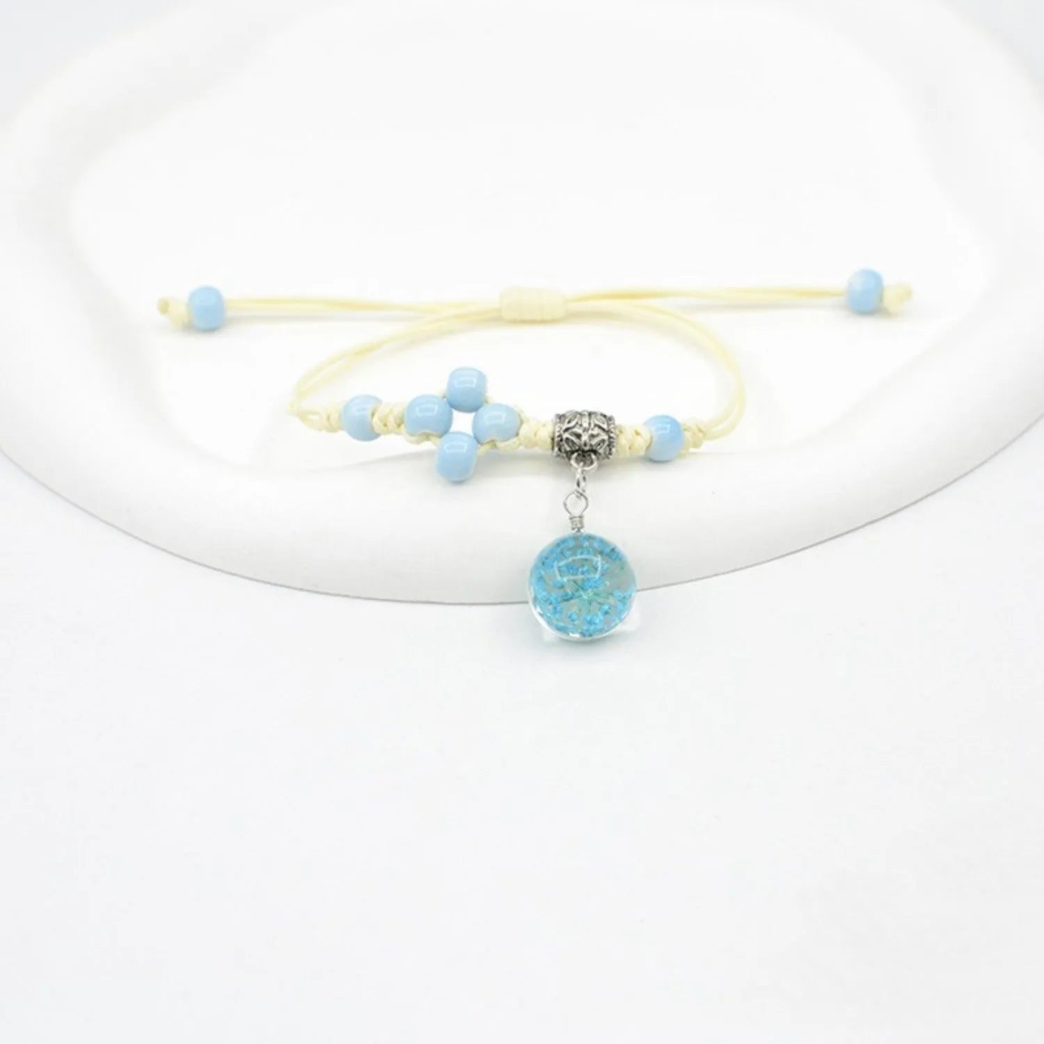 Glass dried flower bracelet with real preserved flowers and colourful 1.4cm beads in hand-woven design