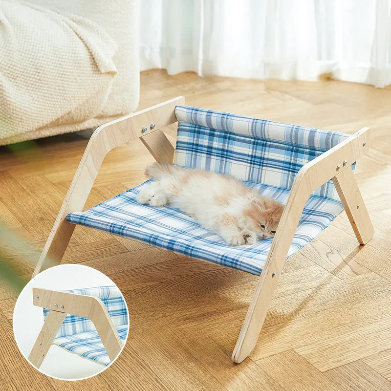 Wooden elevated cat bed hammock with cloth cushion in blue or green colour.