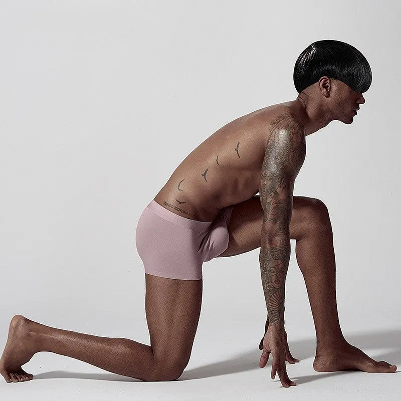 Seamless one-piece men's modal underwear in mid-waist design shown in green colour