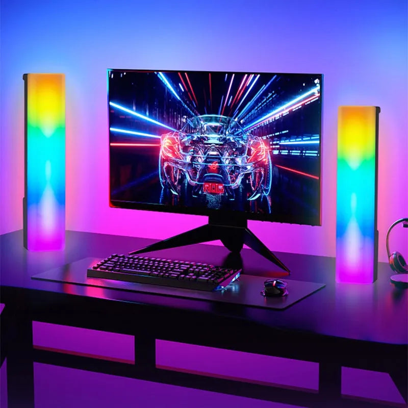 3D RGB table lamp with colourful rhythm lighting on desk beside gaming PC