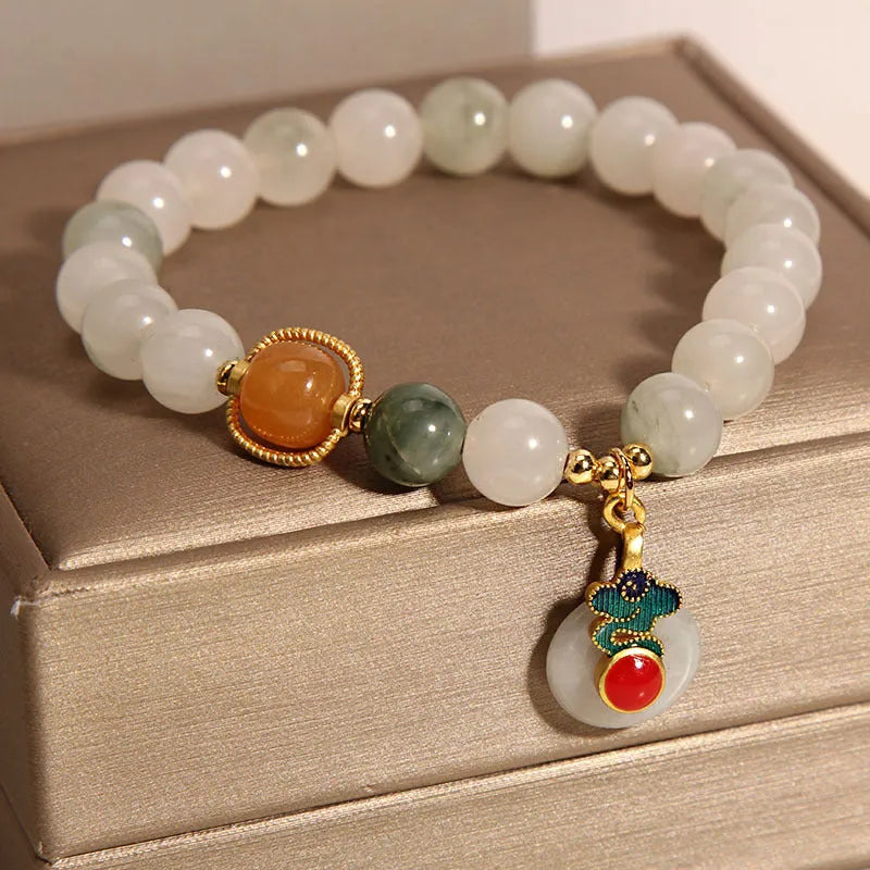Women's ice jade crystal bracelet with pearl accents and a jade buckle on a retro design.
