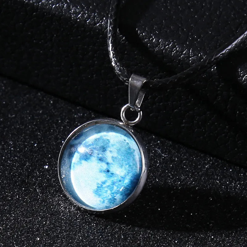 Luminous moon and constellation night sky pendant on an extendable alloy necklace chain.