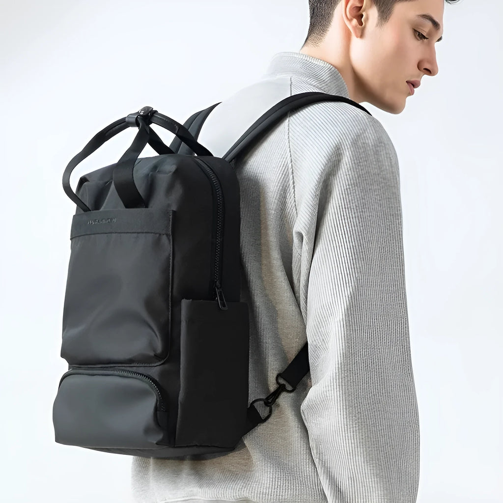 Black Oxford cloth computer backpack with 20-35 litre capacity and polyester lining
