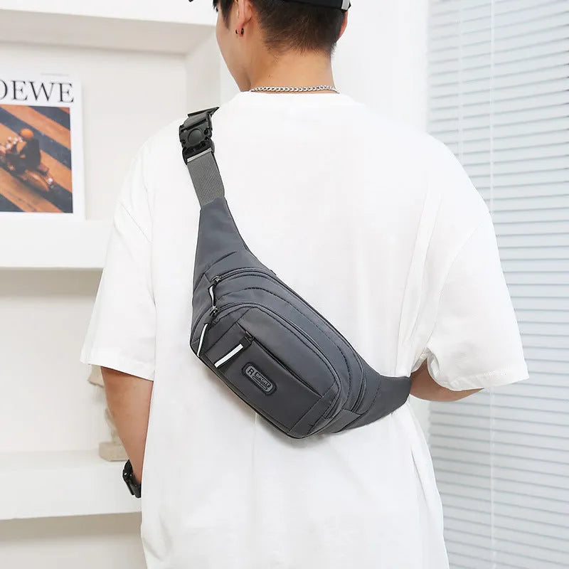 Men's nylon waterproof waist bag in black with a 40cm width for crossbody carry