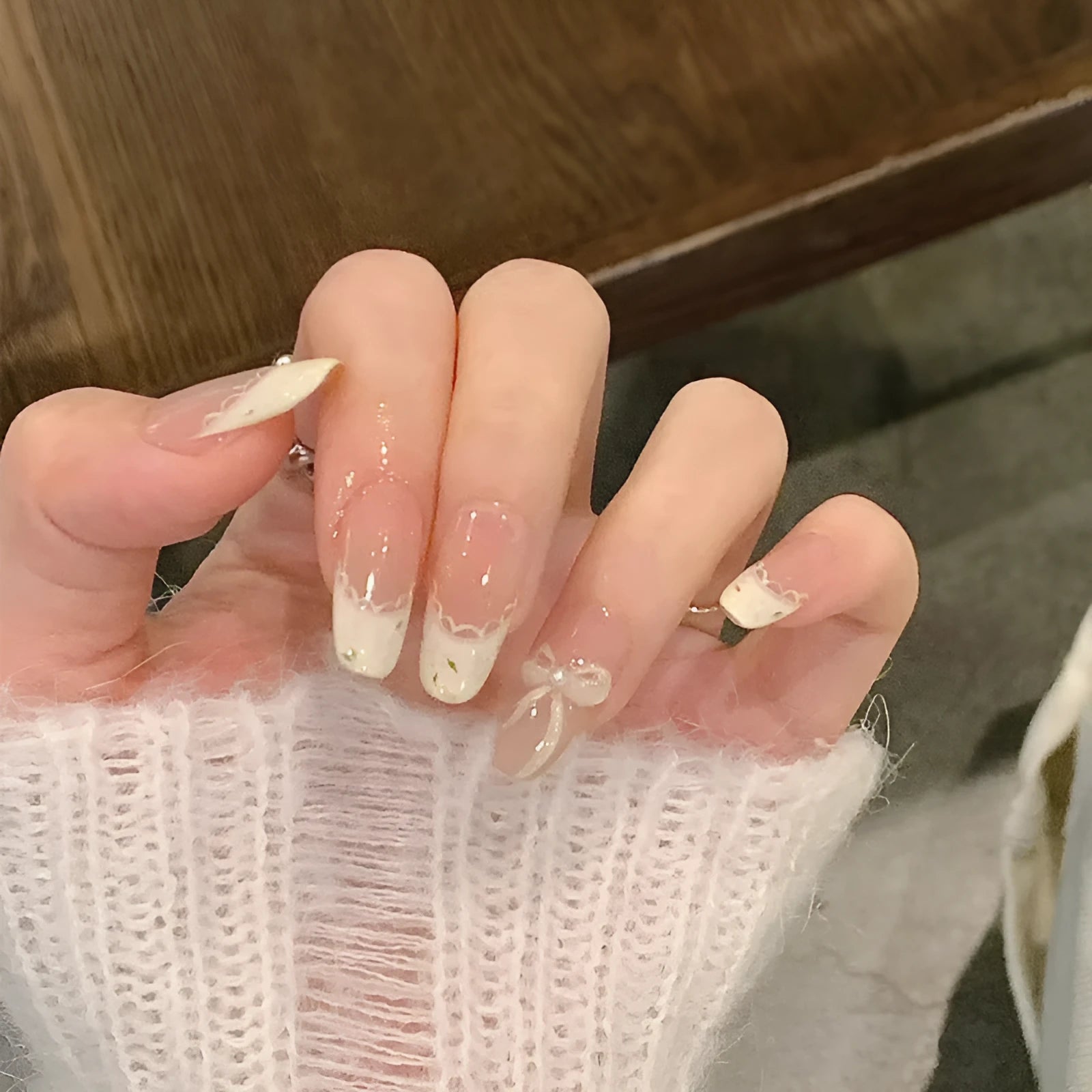 Press-on false nail kits showing multiple sets with assorted colours and adhesive tabs