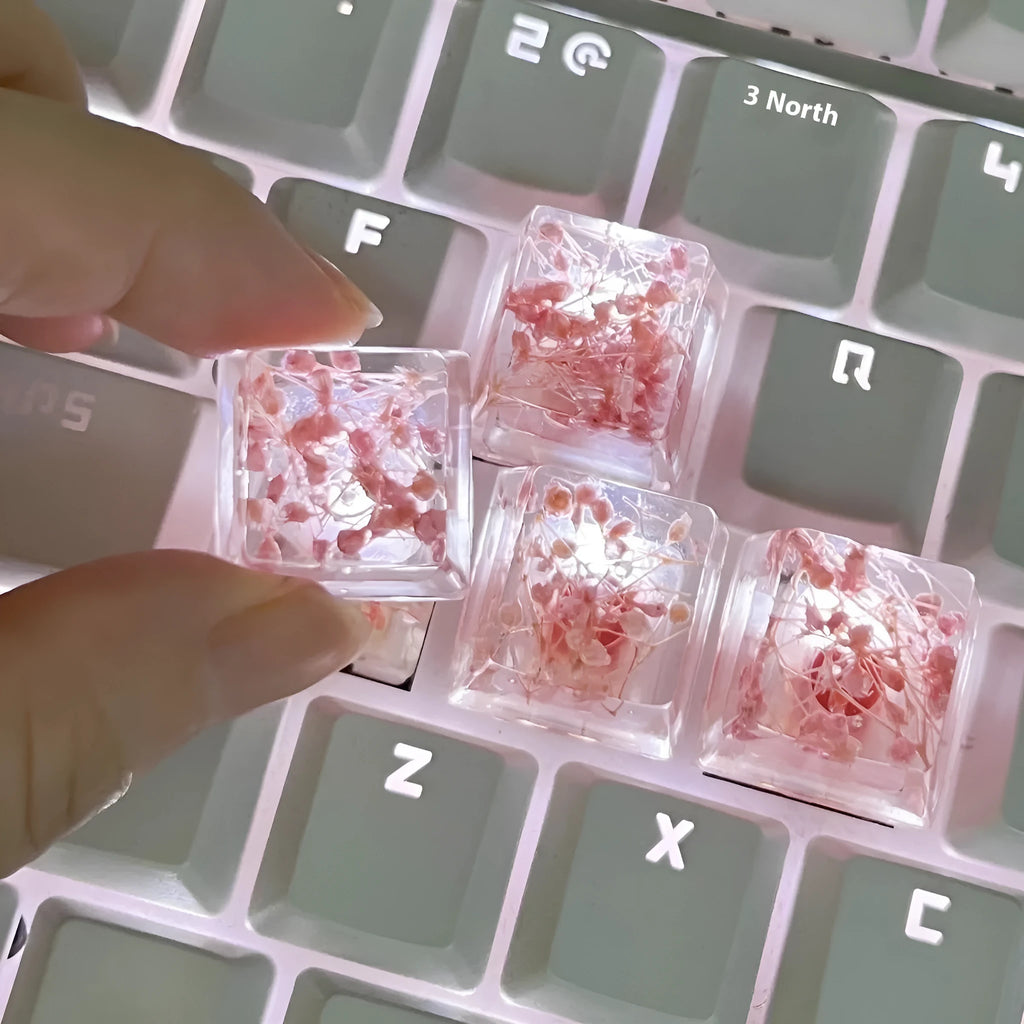High transparency resin mechanical keyboard keycap with starry sky design in one of four colours.