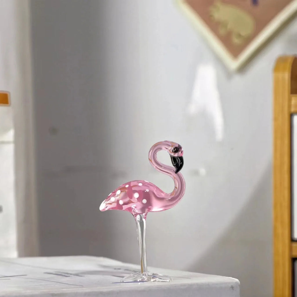 Pink crystal flamingo decorative sculpture on a table, modern simple style.