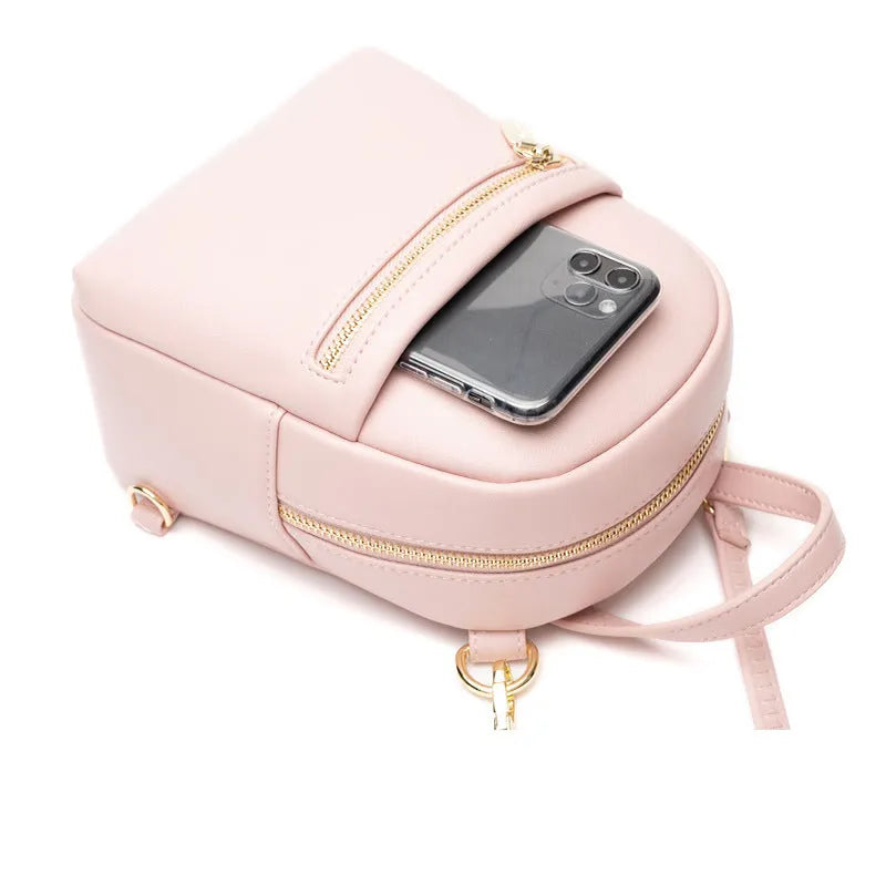 Soft PU mini backpack in street style, shown in one of six colours with contrast details and external 3D pocket.