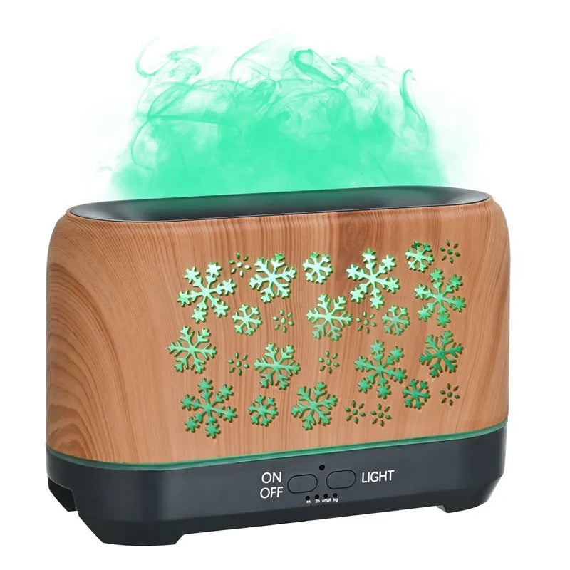 Colourful snowflake wood grain aromatherapy humidifier with glowing flame effect on a desktop.