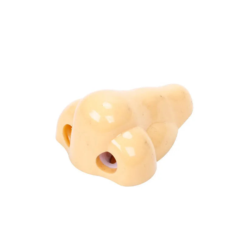 Flesh coloured plastic pencil sharpener with big nostril design for manual pencil sharpening