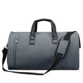 Light grey oval travel bag with multiple internal compartments including a camera insert and wet/dry separation bags.