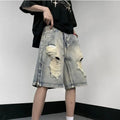 Blue retro tattered denim shorts with a wide leg loose fit on a mannequin.