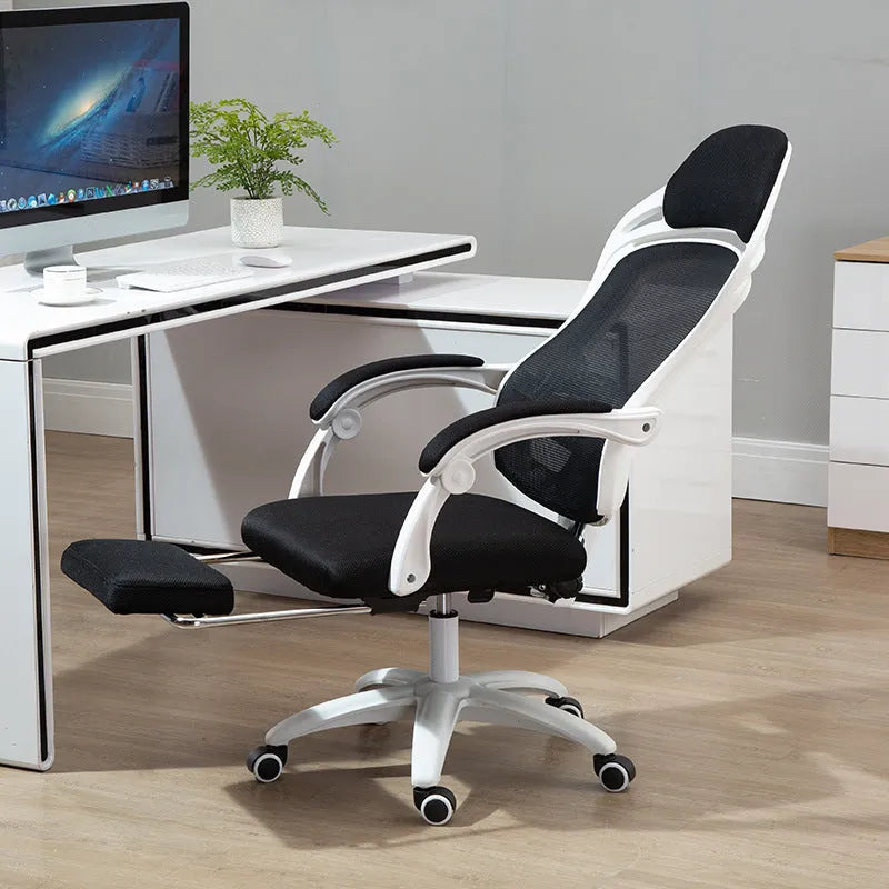 Ergonomic computer gaming chair with black frame, footrest, linkage armrests, and nylon wheels on a hard floor.