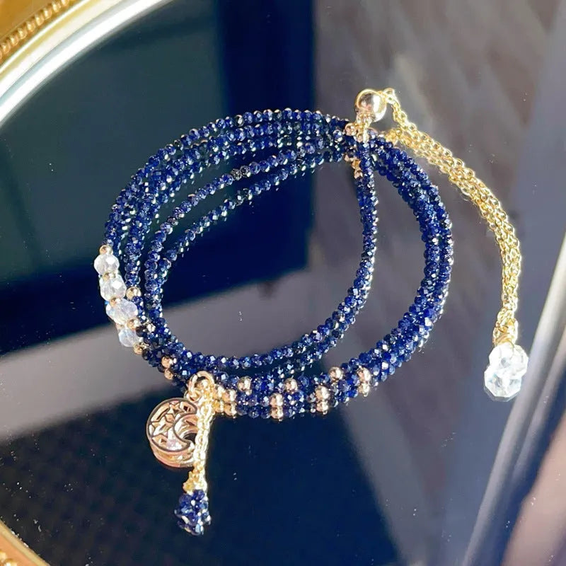 Women's three-ring layered bracelet with blue sand stone beads and gold-toned metal components