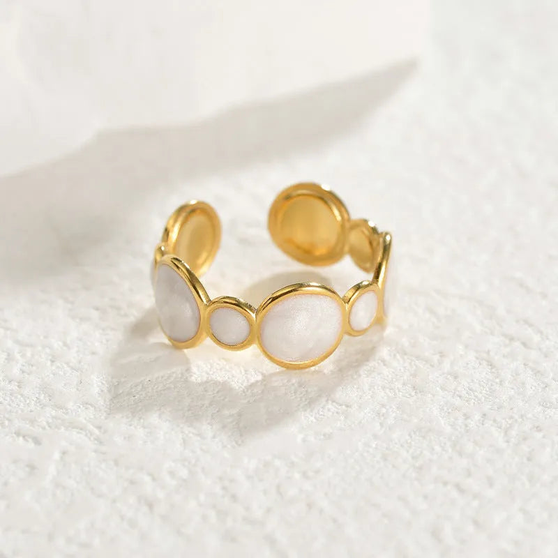Stainless steel geometric ring with adjustable opening and electroplated metallic finish
