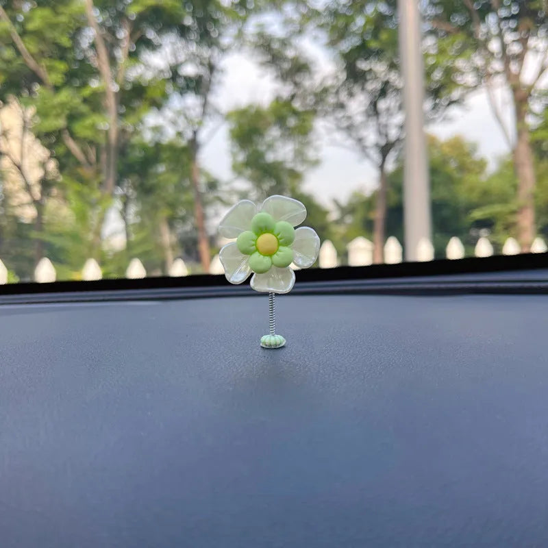 Colourful plastic swing car decoration measuring 5cm tall