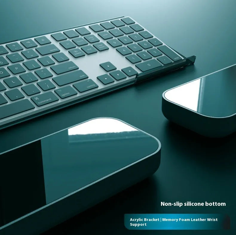 Double-sided keyboard and mouse pad with memory foam base, wrist support, and resin surface.