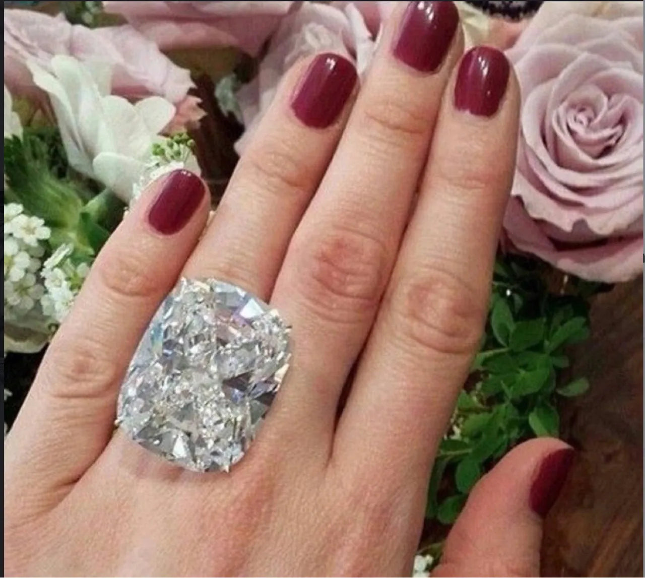 Women's simple white gold colour alloy ring with a square diamond inlay, shown on a finger.