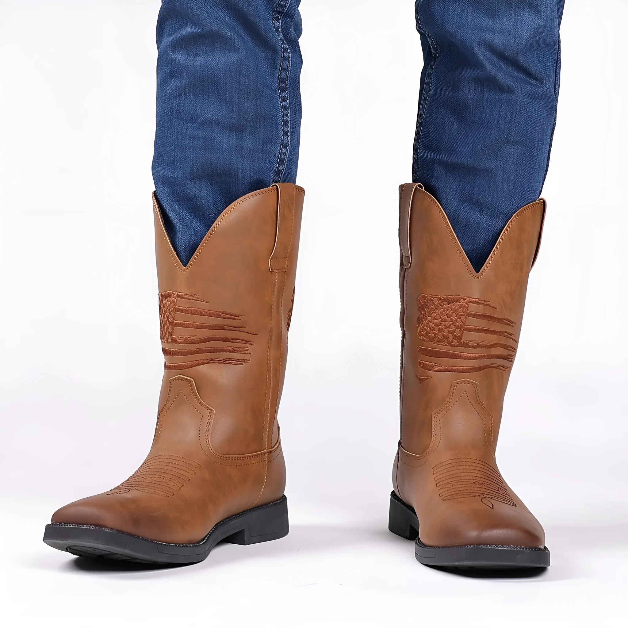 Brown retro wide head cowboy boots with embroidery, square toe, and a low heel on a plain background.