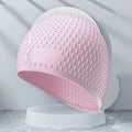 Solid colour silicone swimming cap for adults, shown in multiple colour options.