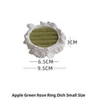 White gypsum rose ring storage tray with fabric coating on a dresser surface