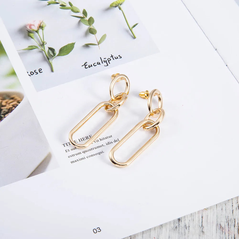 Sterling silver geometric hoop earrings with ring and line detailing