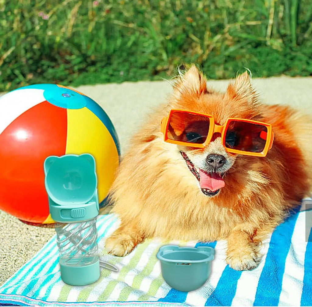 Green 3-in-1 portable pet water bottle with food container and waste bag dispenser for dogs and cats