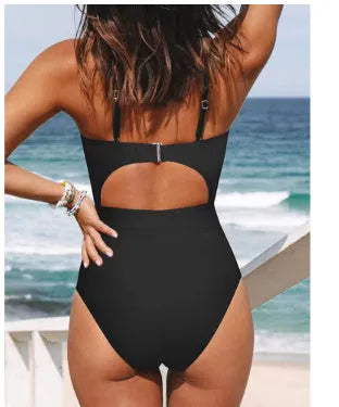 Women's solid colour backless one-piece swimsuit in black, red, or blue.