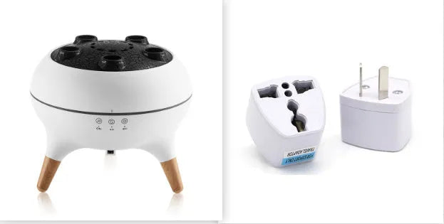 White jellyfish-shaped ultrasonic humidifier and aroma diffuser with remote control and timer on a table