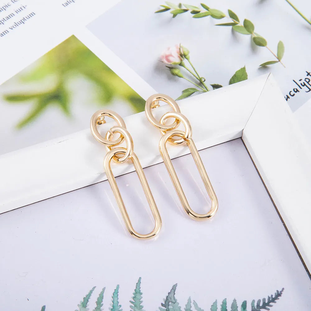 Sterling silver geometric hoop earrings with ring and line detailing