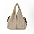 Apricot-coloured cloth pet carrier handbag for outdoor use with small pets.