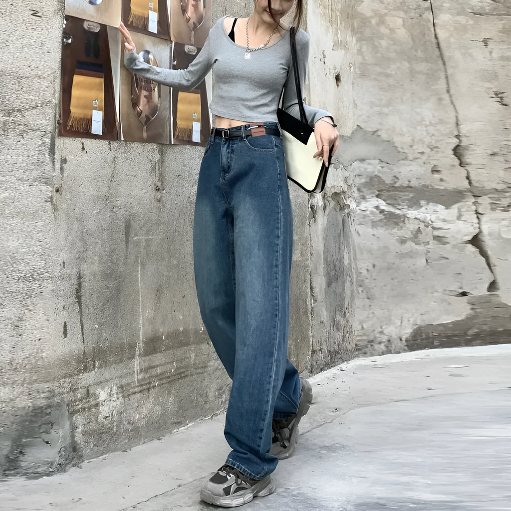 Women's high waist straight leg jeans in a retro blue wash, showcasing the denim fabric and cut.