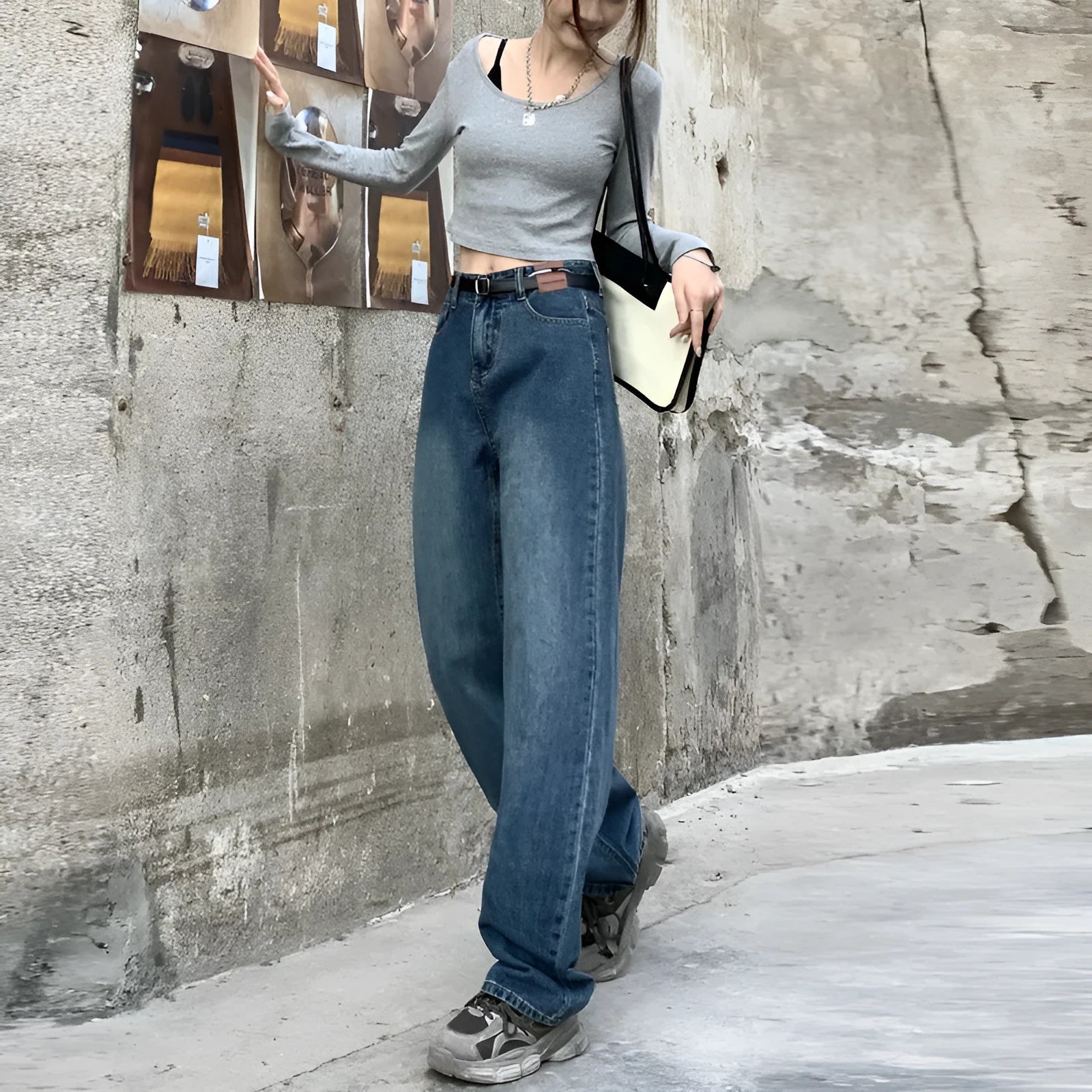 Women's high waist straight leg jeans in a retro blue wash, showcasing the denim fabric and cut.