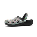 Black women's platform sandals with rhinestone decoration and a holey EVA upper.