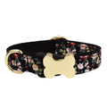 Flat nylon dog collar with printed grid pattern and a white bone-shaped buckle on a red background.