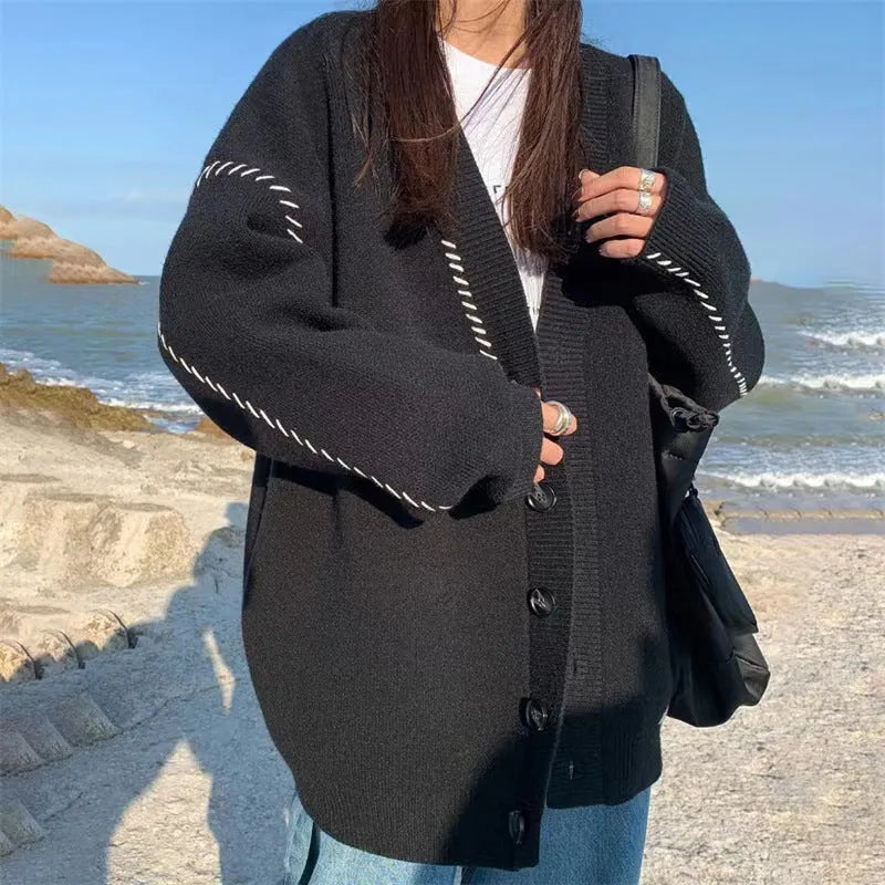 Women's knitted cardigan coat in black with loose fit and long sleeves