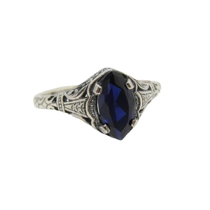 Women's silver geometric hollow-out alloy ring showing detailed pattern and zircon elements