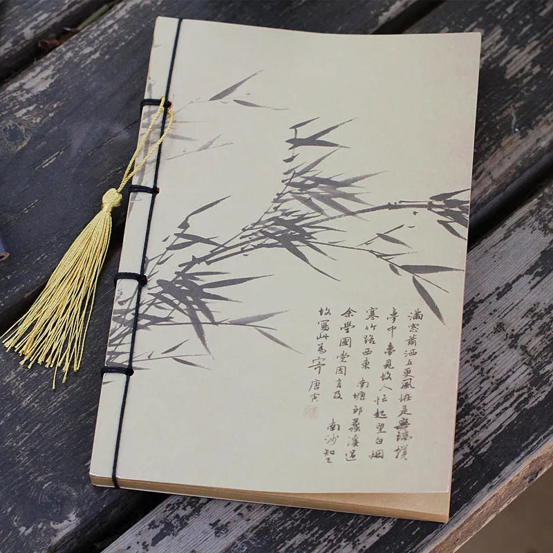 A5 antique thread-bound notebook with embossed cover and decorative tassels