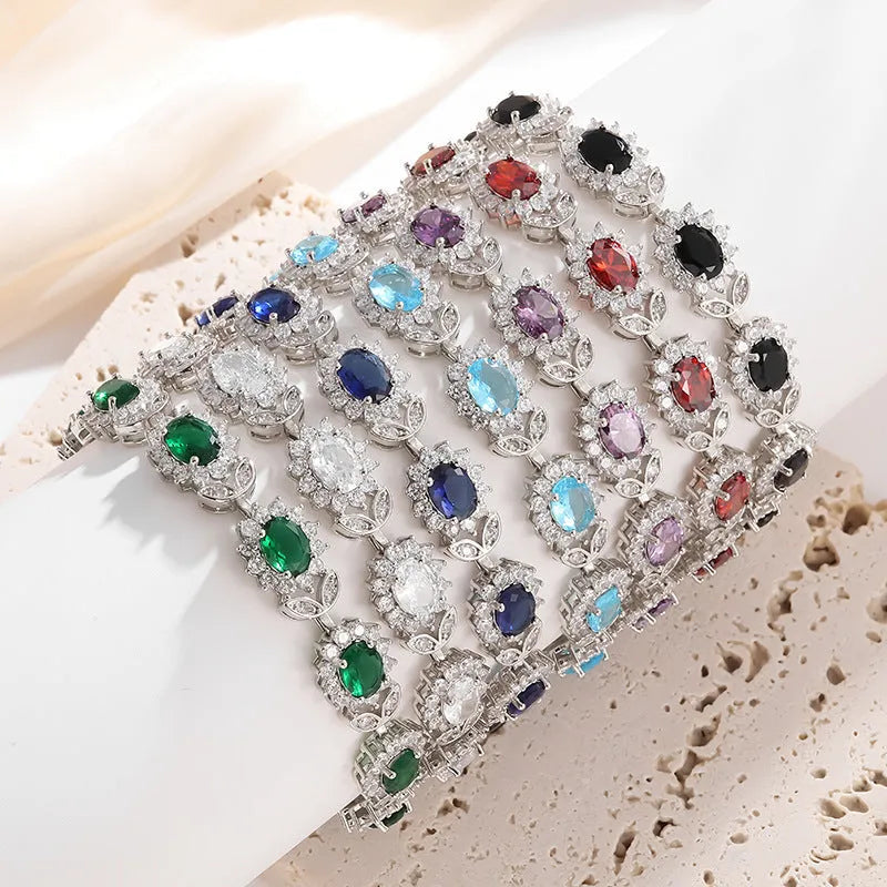 Women's bracelet with coloured zircon stone inlays in environmentally friendly alloy with electroplated finish
