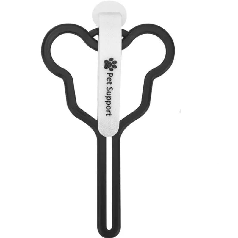 A hands-free dog waste bag holder with a fixed clip and adjustable Velcro strap attached to a pet leash.