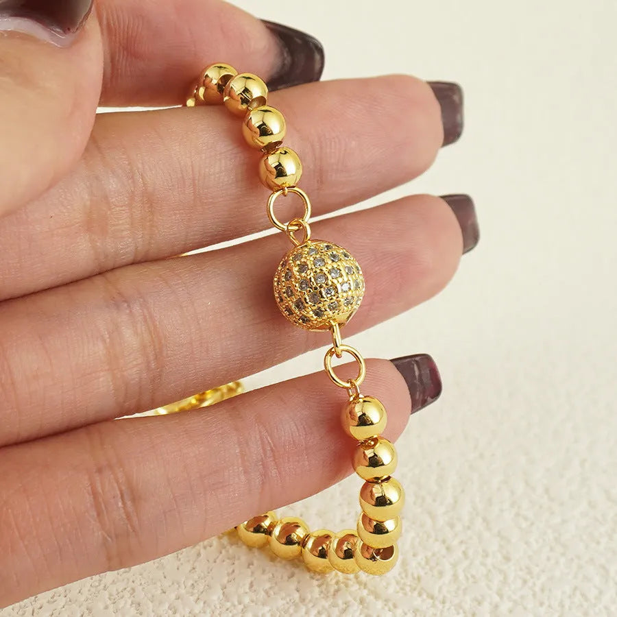 Women's heart-shaped copper bracelet with zircon stones in an Arabic style design.